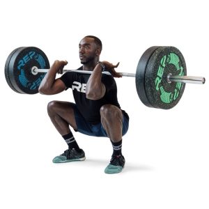 a man is holding while doing squats rep fitness colorado barbells on a white background