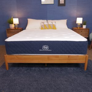 Brooklyn Bedding Signature Hybrid mattress in a stylish bedroom with blue walls