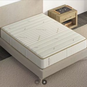 Saatva Zenhaven Latex mattress on a neutral-colored bed frame, ideal for fibromyalgia support