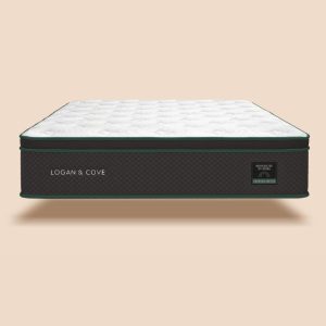 Luxury mattress with a quilted white top and dark green and black sides, displayed against a neutral background