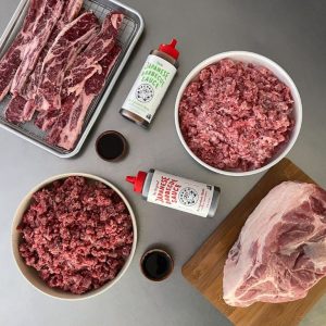 several prepared meat on a table from the meat delivery box company porter road