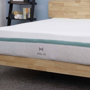 Helix Sunset mattress on a wooden bed frame in a modern bedroom.