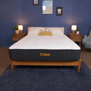 titan plus mattress on wooden bed frame in chic bedroom environment