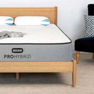 Bear Pro Hybrid mattress on wooden bed frame for premium comfort