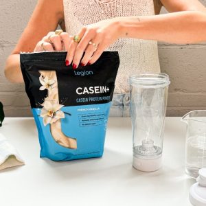 Tester opening a bag of Legion Casein+ protein powder