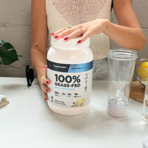 Tester opening a jar of Transparent Labs 100% Grass-Fed Whey Protein Isolate