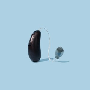 Audicus Spirit hearing aid with slim and discreet design on blue background