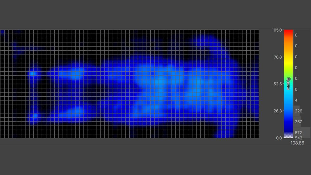 Heat map visualization from a pressure mapping test, showing varying pressure points on a mattress with a color scale ranging from blue to red